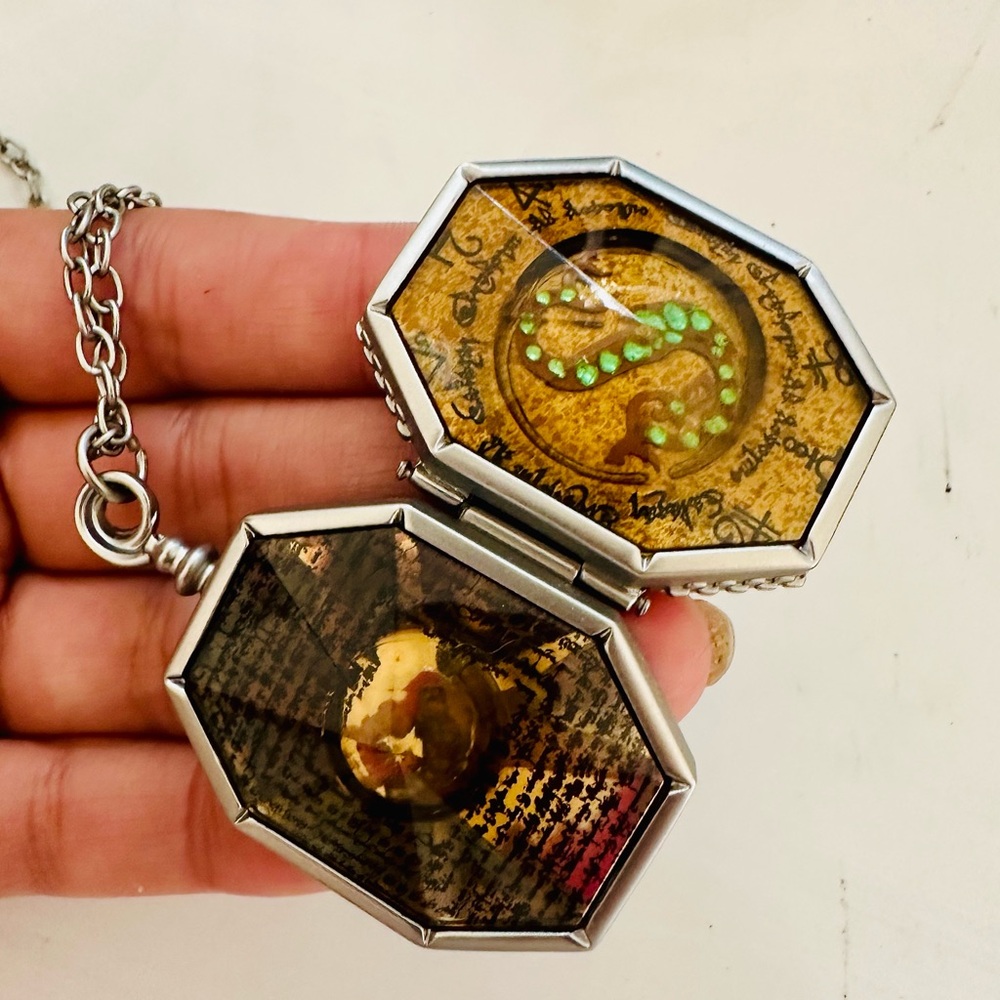Noble collection brand Slytherins locket with display case